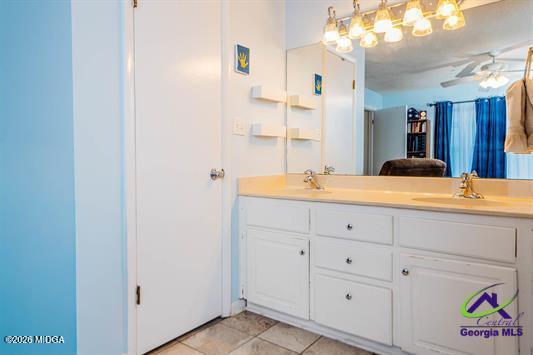 200 Atrium Court Warner Robins, GA 31088 - Photo 6 of 31 a bathroom with a double vanity sink and a mirror