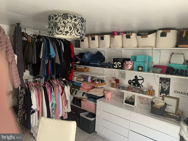 a bedroom with a bed a desk and chair