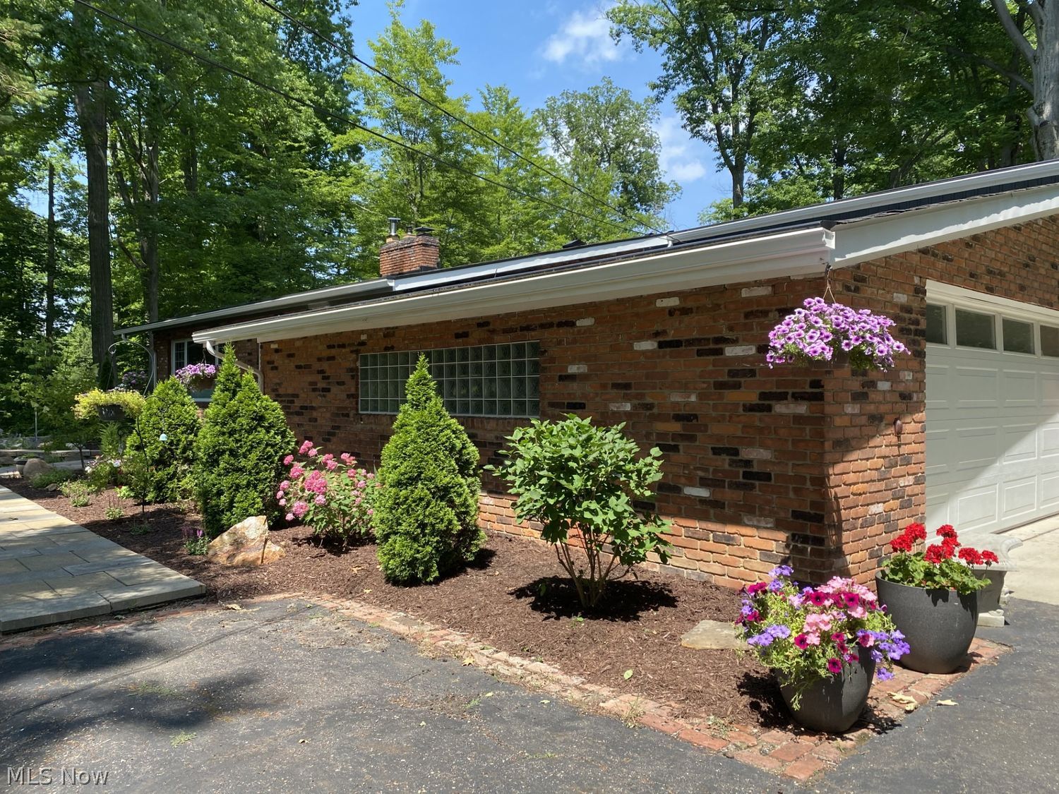 11385 County Line Road Chesterland, OH 44026 - Photo 19 of 26 Beautiful landscaping with gutter helmets.