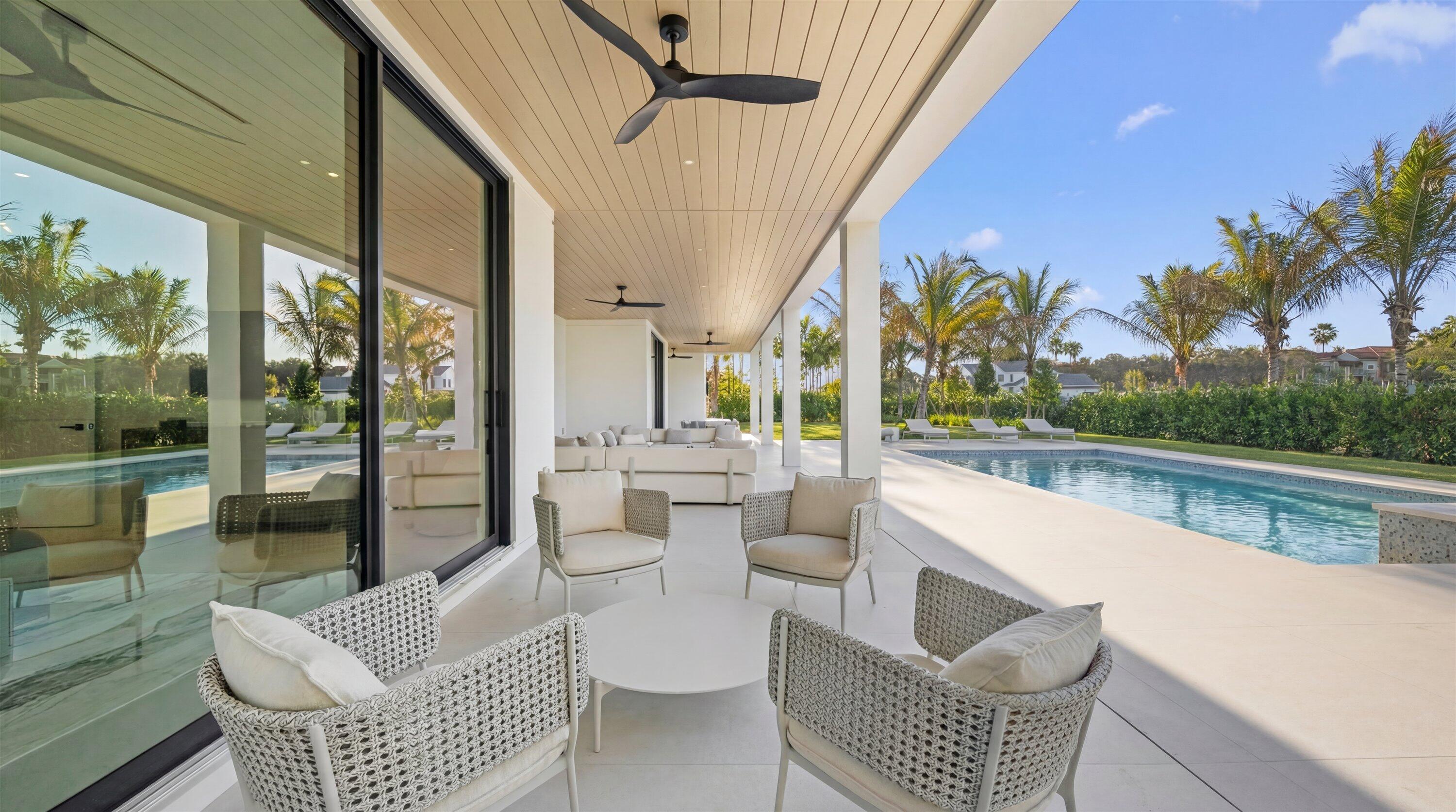 11368 Polo Park Trail Wellington, FL 33414 - Photo 15 of 33 a outdoor living space with patio furniture and a potted plant