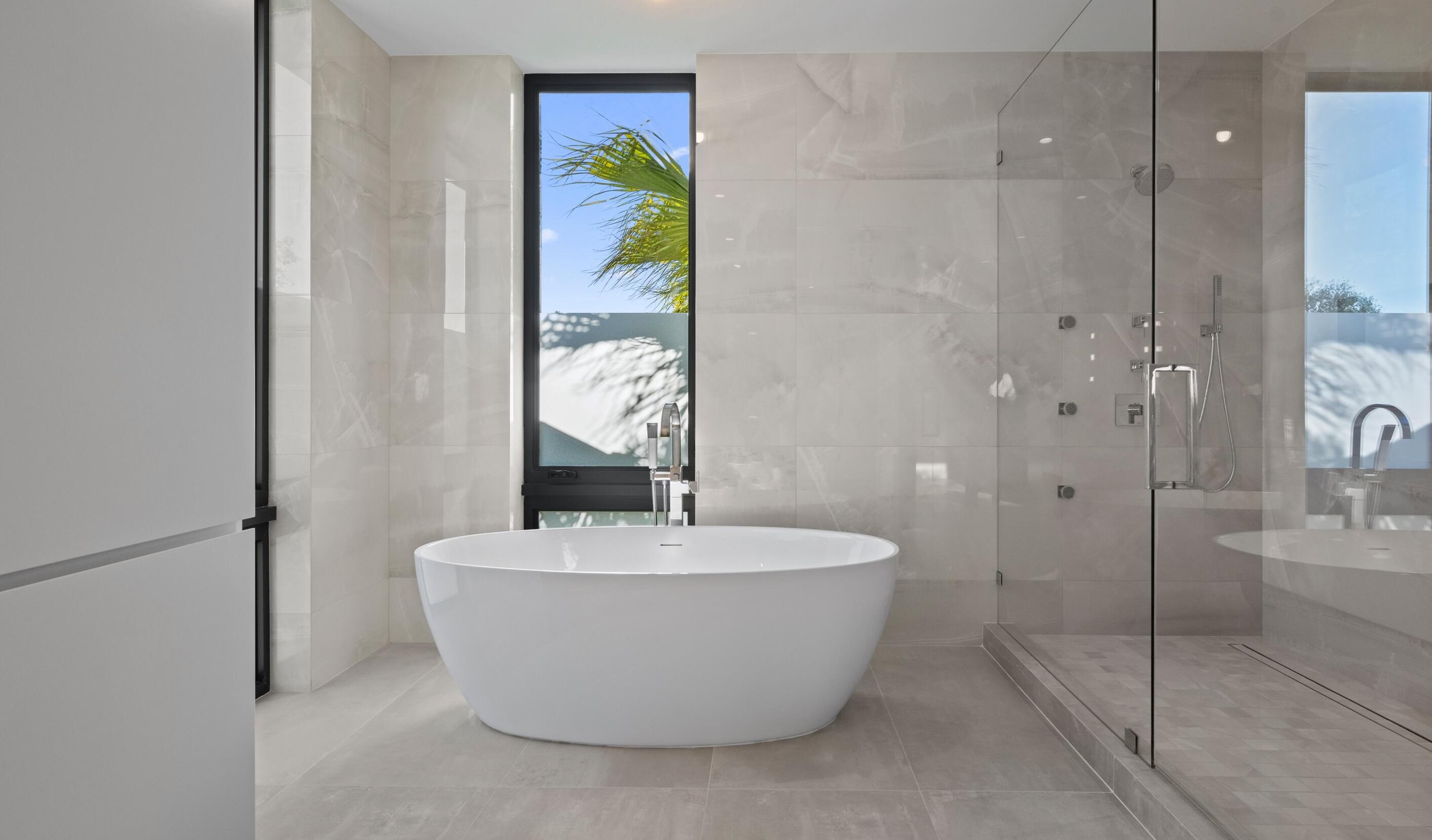 11368 Polo Park Trail Wellington, FL 33414 - Photo 17 of 33 a bathroom with a bathtub and shower