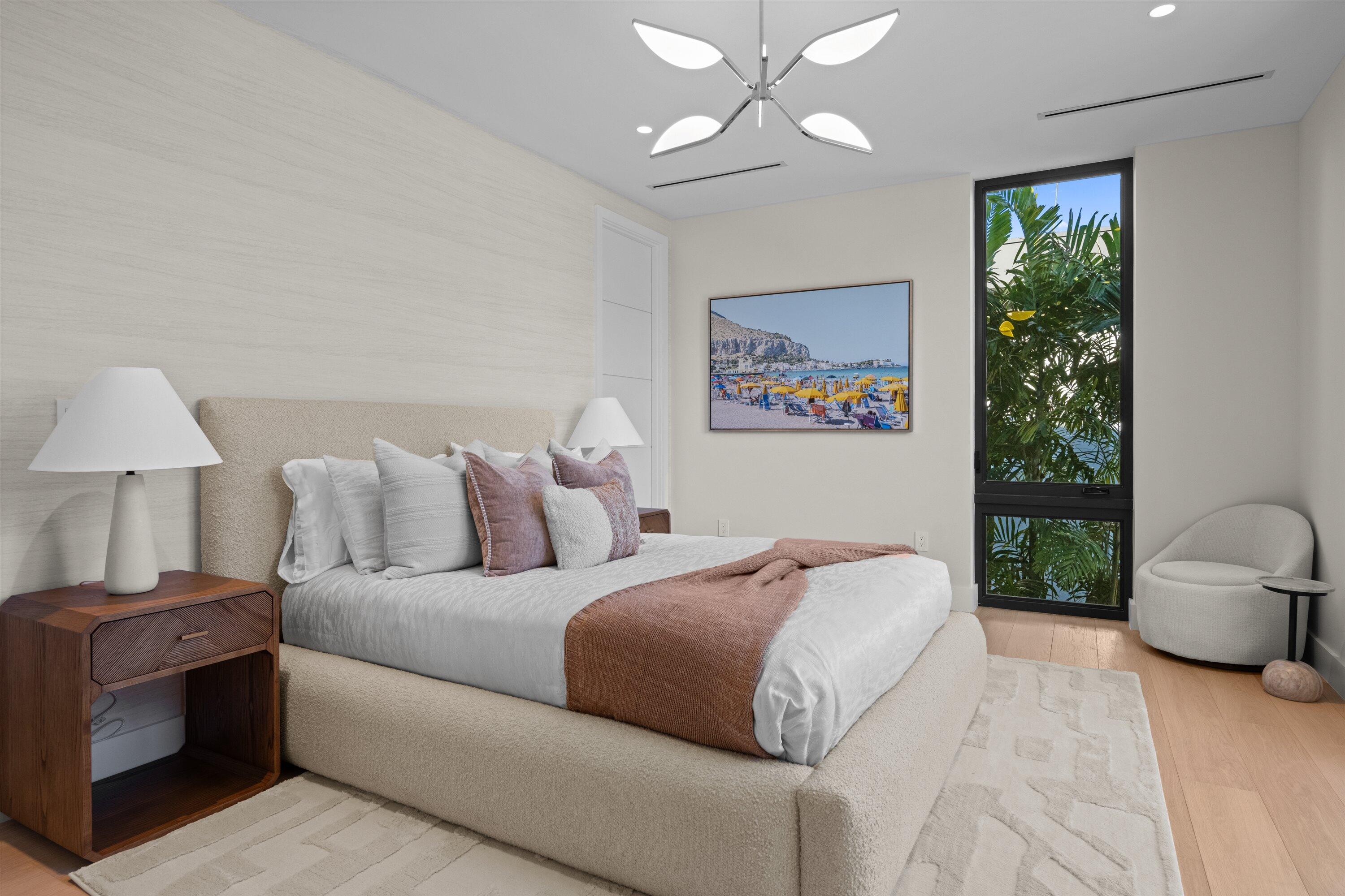 11368 Polo Park Trail Wellington, FL 33414 - Photo 19 of 33 a bedroom with a large bed and a chandelier
