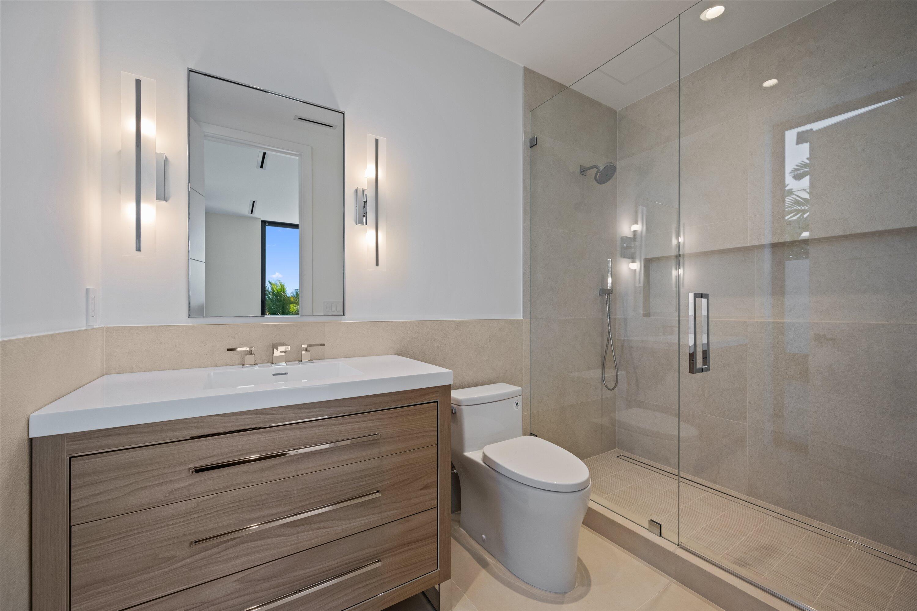 11368 Polo Park Trail Wellington, FL 33414 - Photo 20 of 33 a bathroom with a toilet sink and shower