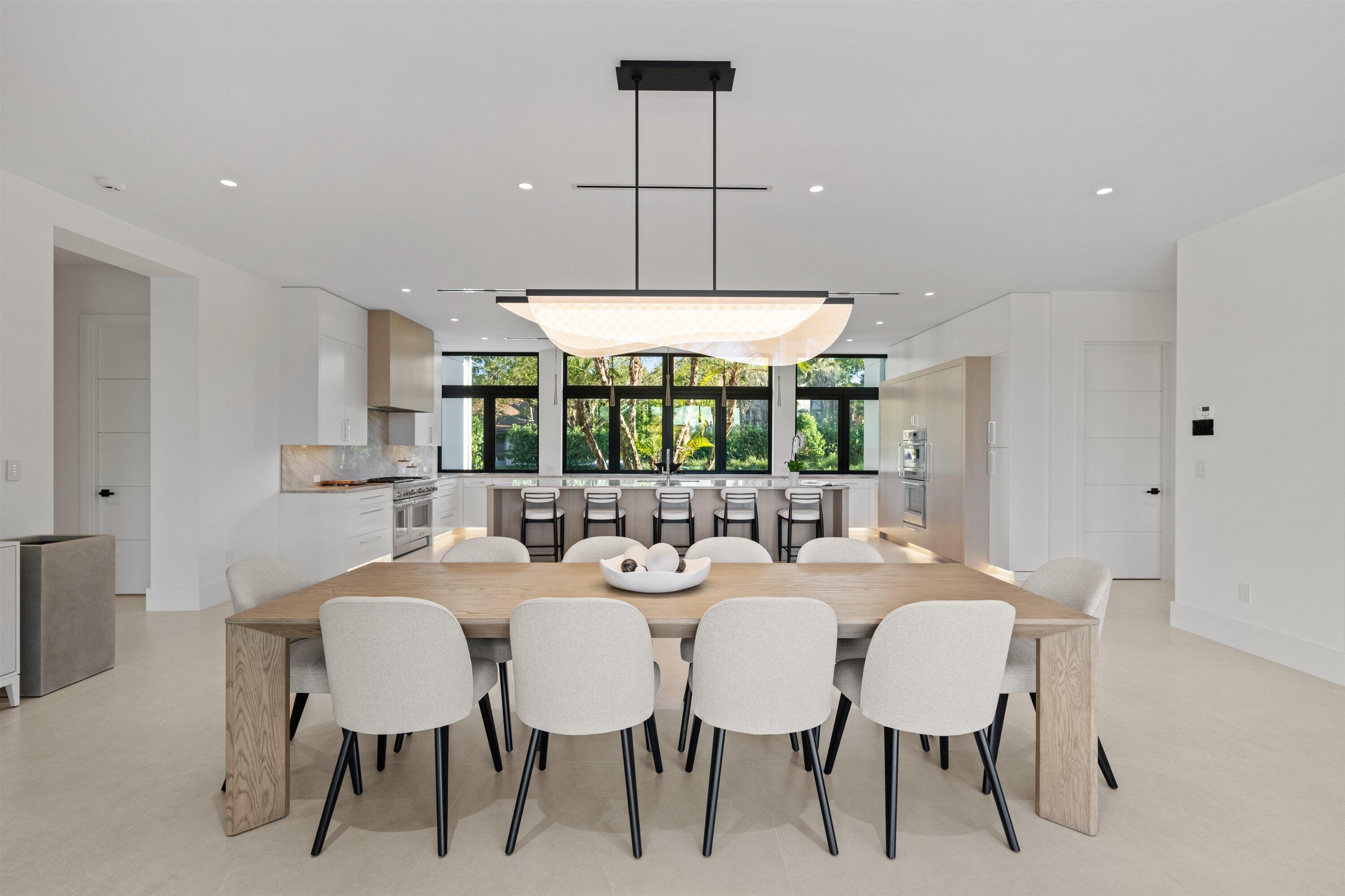 11368 Polo Park Trail Wellington, FL 33414 - Photo 25 of 33 a dining room with furniture a chandelier and window
