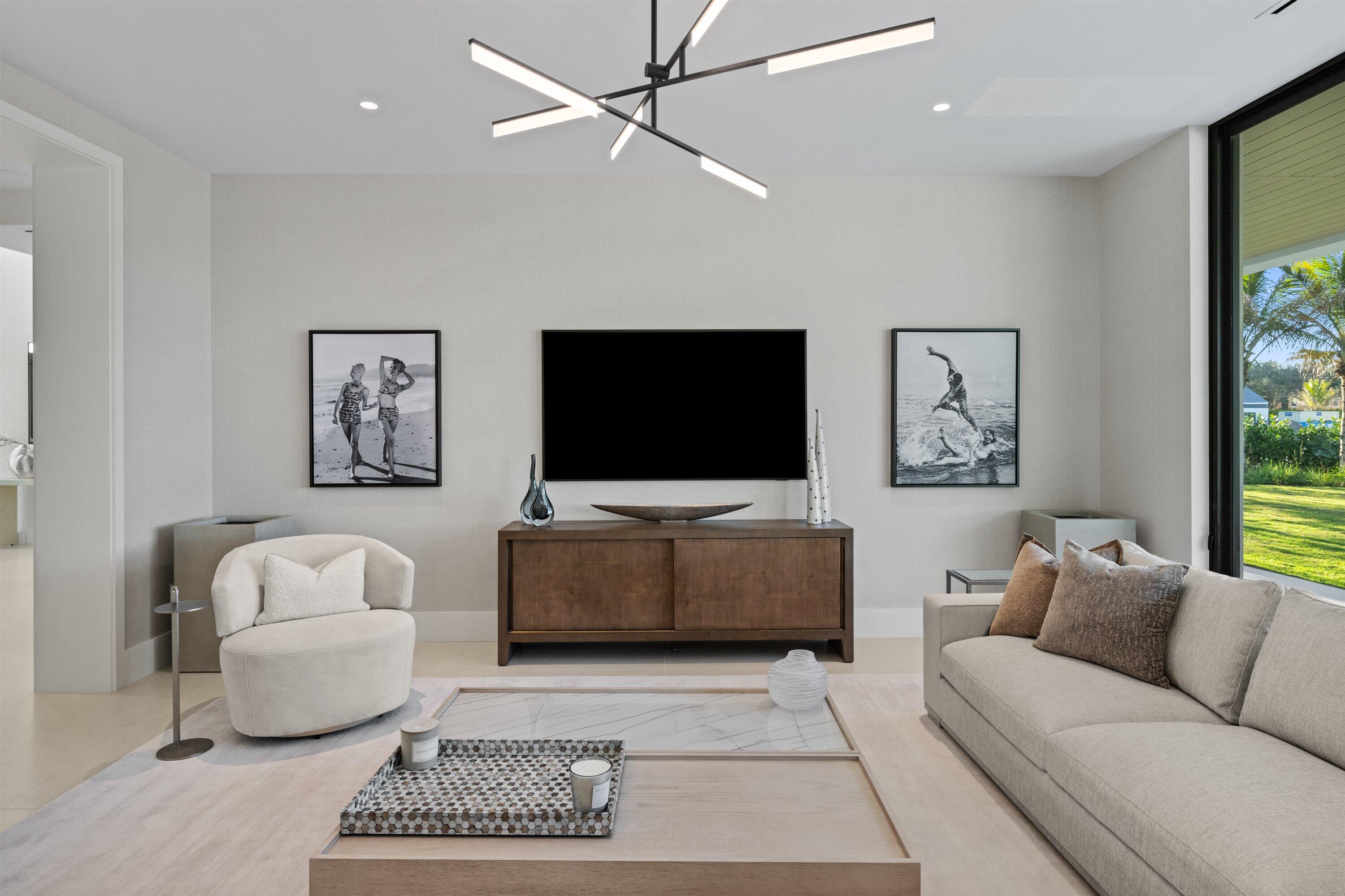 11368 Polo Park Trail Wellington, FL 33414 - Photo 28 of 33 a living room with furniture and a flat screen tv