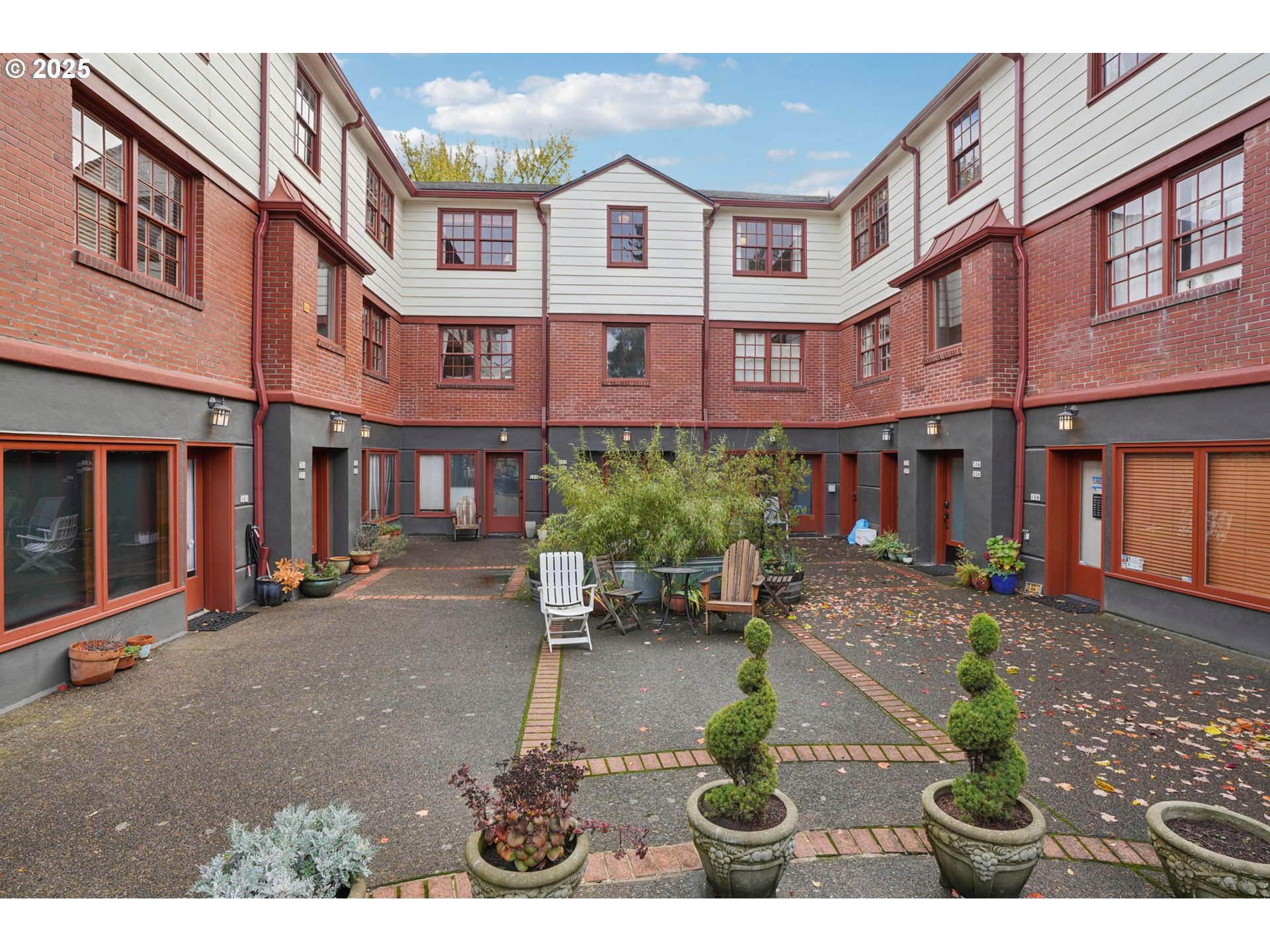 a front view of a brick building with many windows