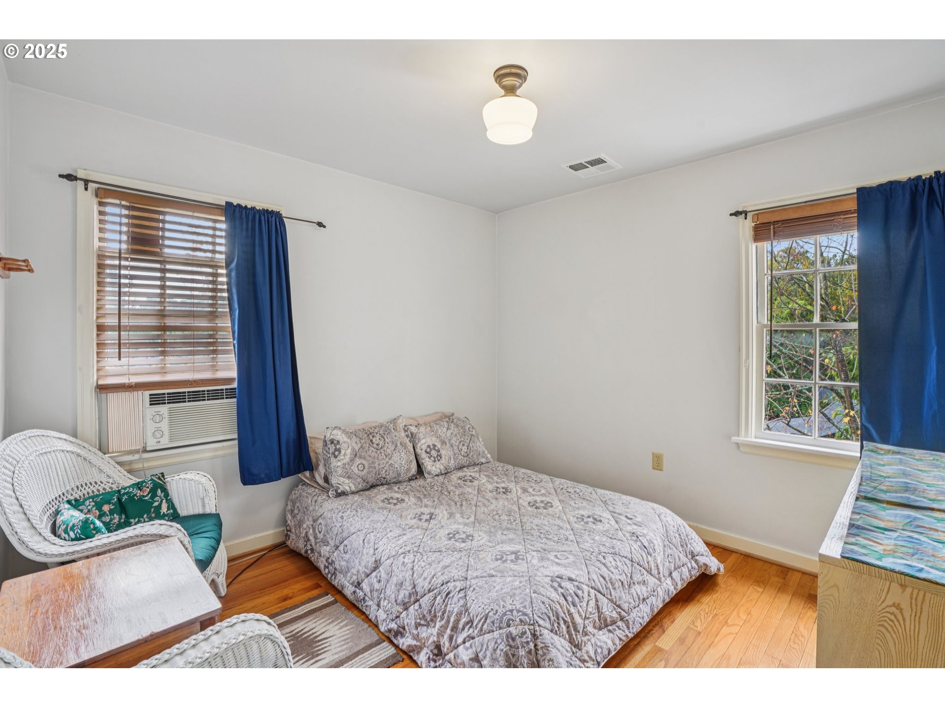 5400 Northeast 30th Avenue, Unit 304 Portland, OR 97211 - Photo 11 of 15 a bedroom with a bed and a window