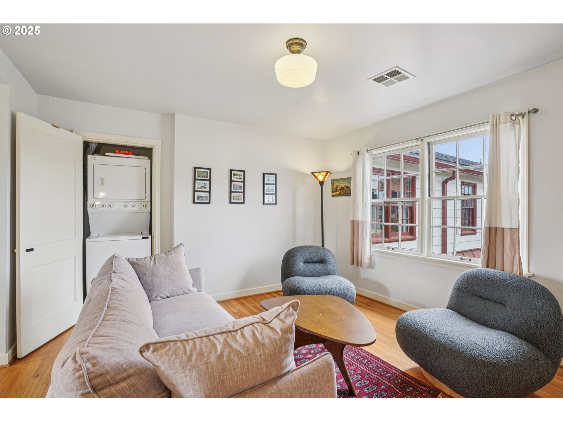 5400 Northeast 30th Avenue, Unit 304 Portland, OR 97211 - Photo 4 of 15 a living room with furniture and a large window