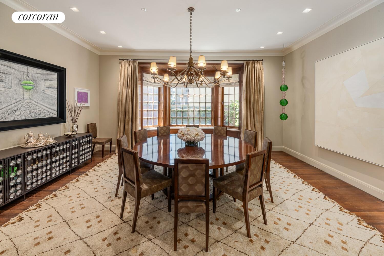 4 East 73rd Street Manhattan, NY 10021 - Photo 12 of 32 a dining room with furniture a chandelier and window