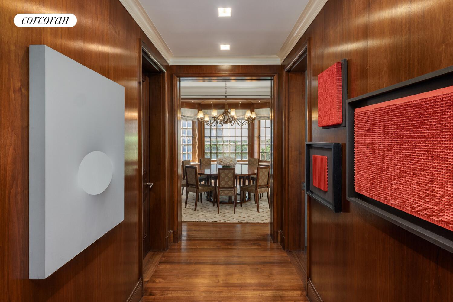 4 East 73rd Street Manhattan, NY 10021 - Photo 14 of 32 a view of a hallway with dining area and chandelier