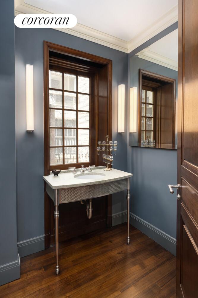 4 East 73rd Street Manhattan, NY 10021 - Photo 16 of 32 a view of a room that has a table and chairs in it