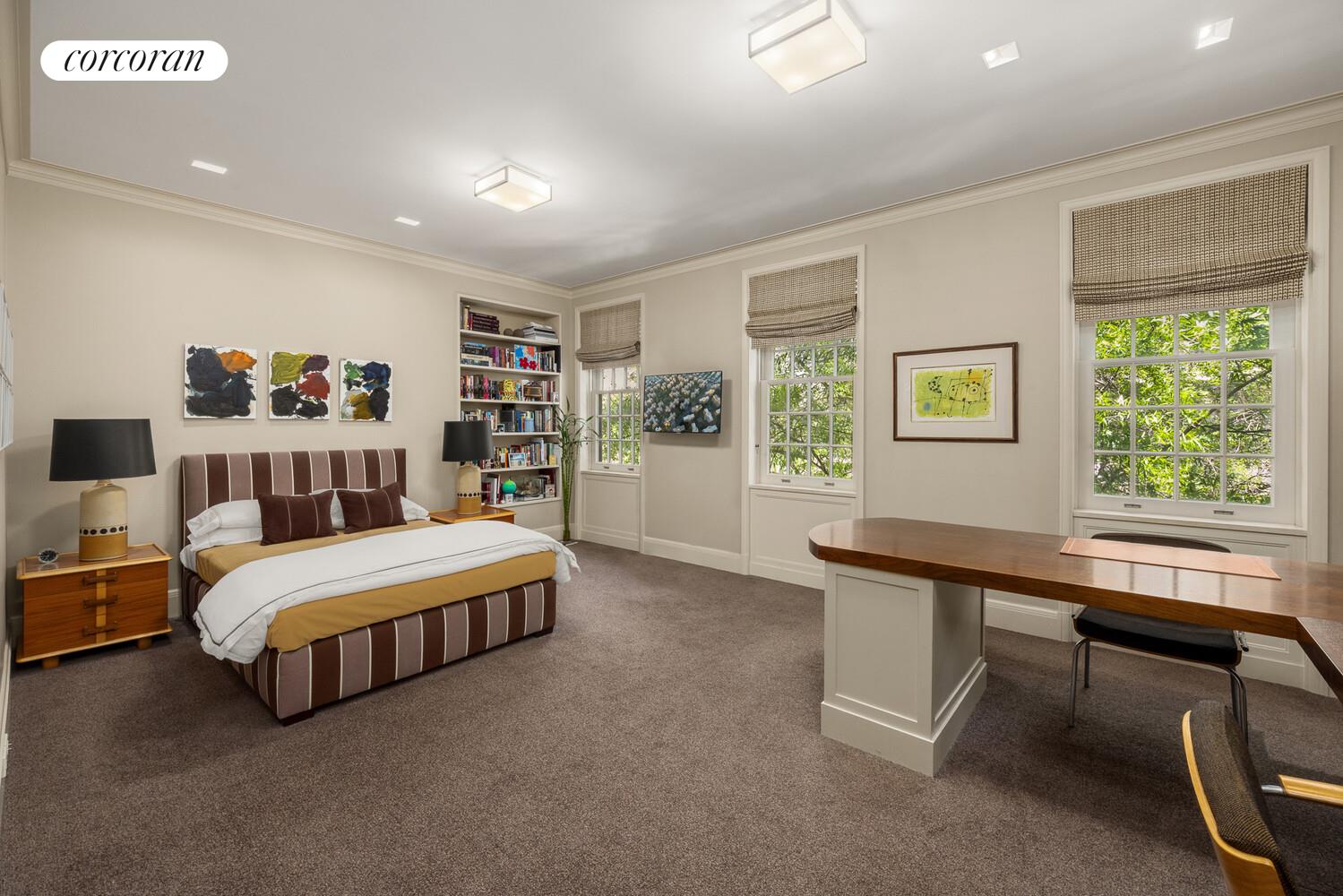 4 East 73rd Street Manhattan, NY 10021 - Photo 22 of 32 a living room with a bed furniture and a window