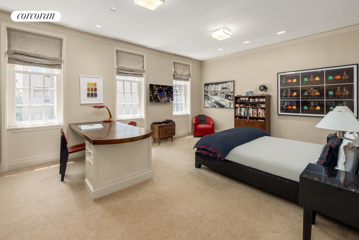 4 East 73rd Street Manhattan, NY 10021 - Photo 24 of 32 a living room with furniture and a table