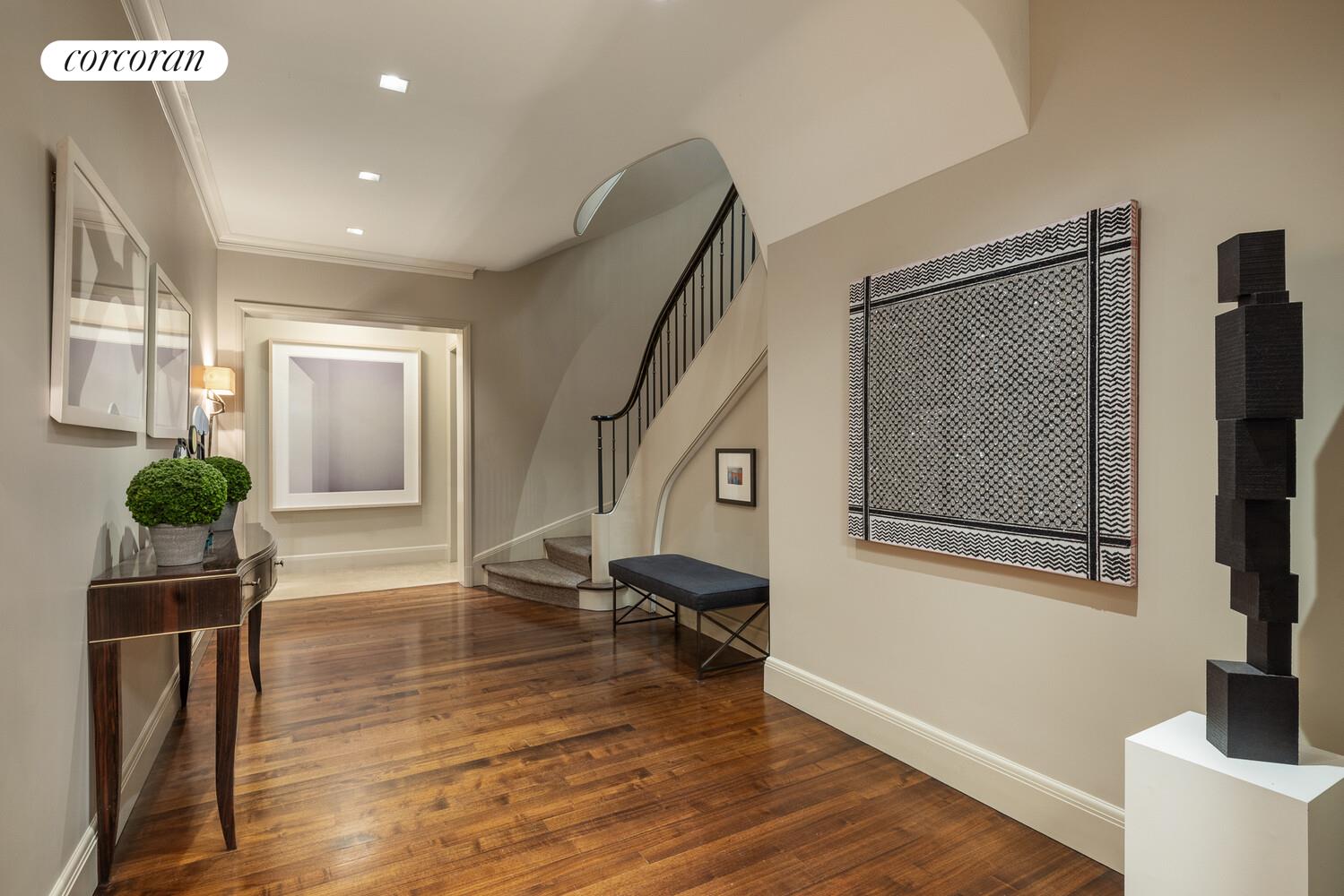 4 East 73rd Street Manhattan, NY 10021 - Photo 2 of 32 a living room with furniture and a potted plant