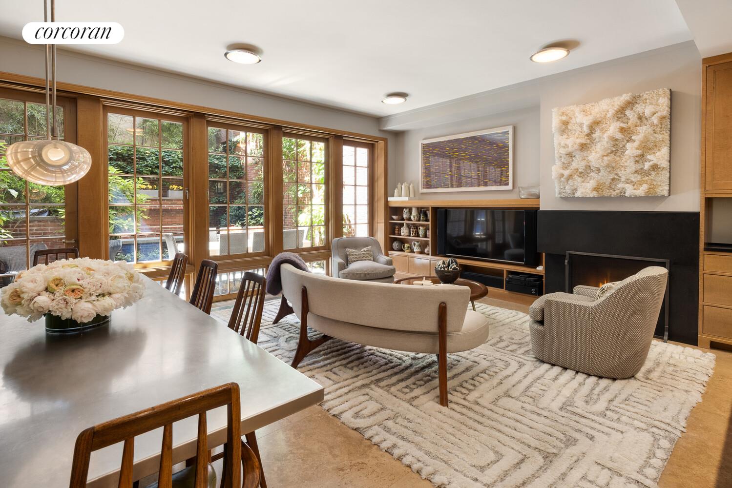 4 East 73rd Street Manhattan, NY 10021 - Photo 3 of 32 a living room with furniture and a large window