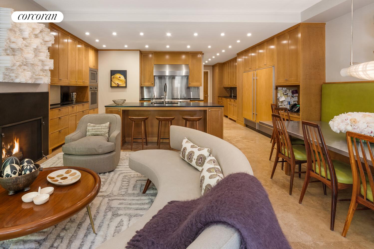 4 East 73rd Street Manhattan, NY 10021 - Photo 4 of 32 a living room with furniture and a view of kitchen