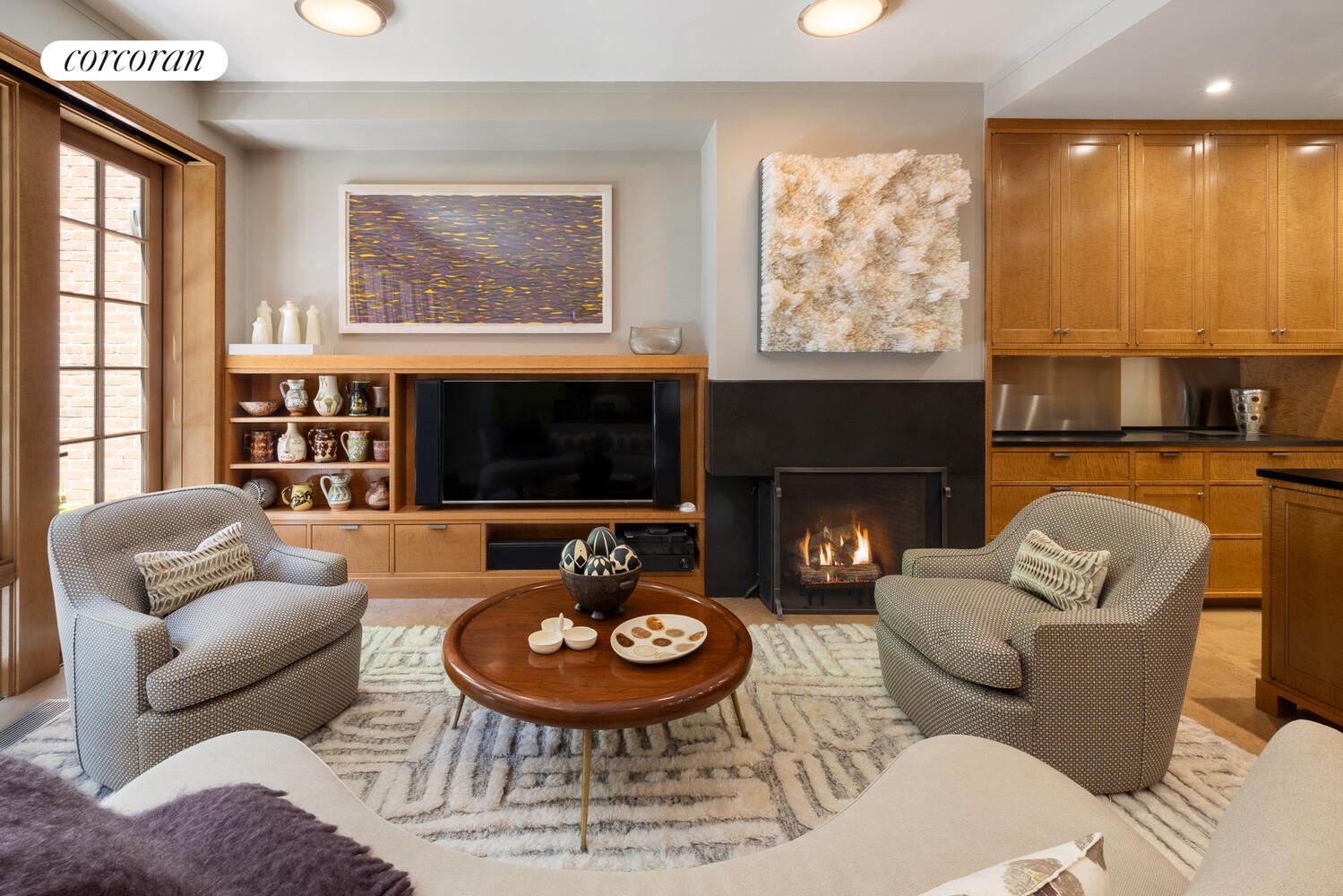 4 East 73rd Street Manhattan, NY 10021 - Photo 5 of 32 a living room with furniture a fireplace and window