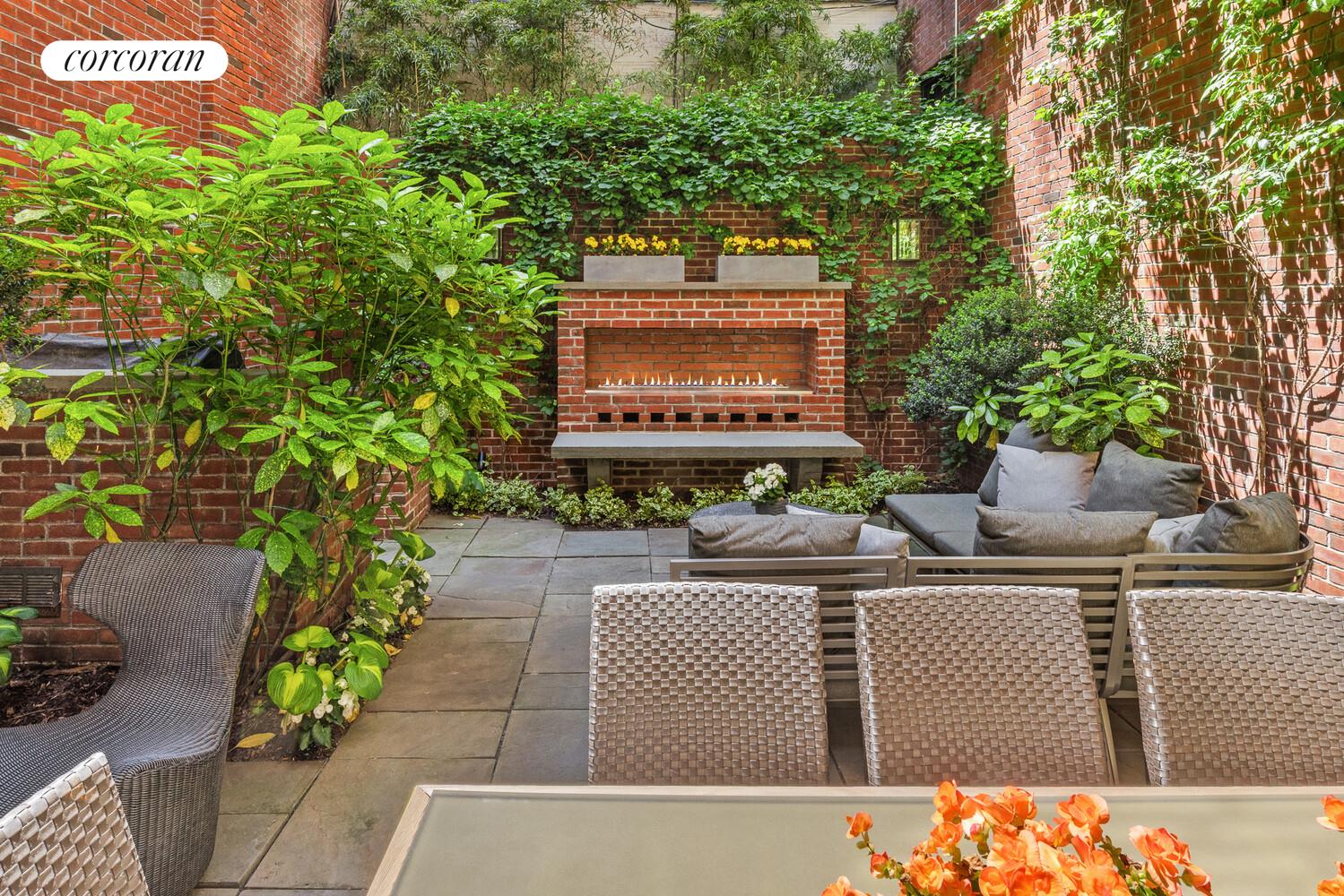 4 East 73rd Street Manhattan, NY 10021 - Photo 6 of 32 a view of a brick wall with a bench in front of it
