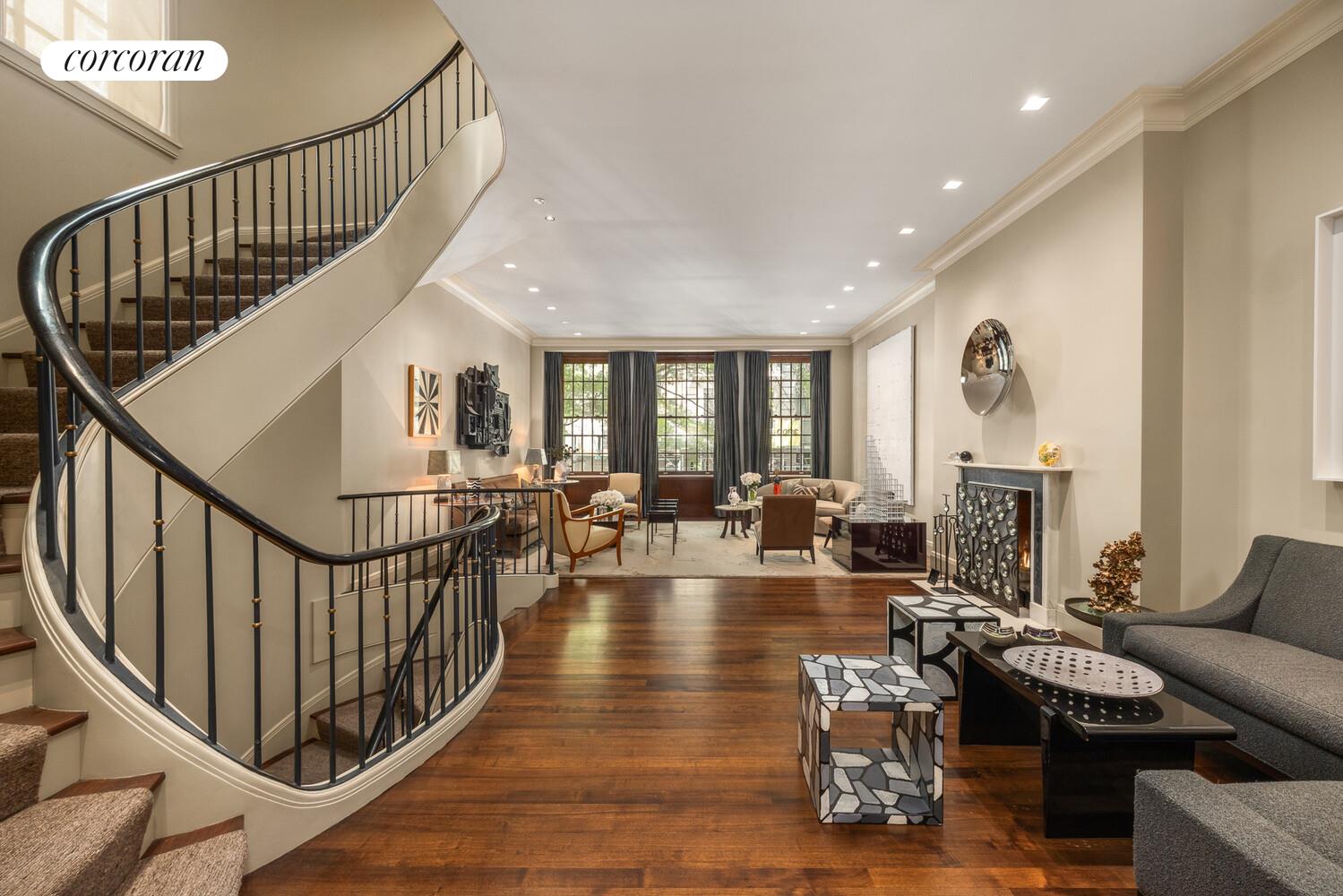 4 East 73rd Street Manhattan, NY 10021 - Photo 9 of 32 a lobby with furniture and wooden floor