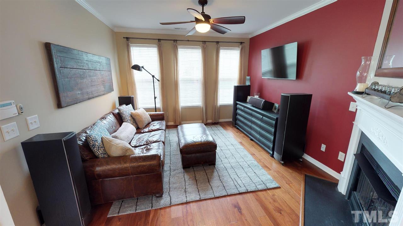5233 Moonview Court Raleigh, NC 27606 - Photo 2 of 25 Natural Gas Log Fireplace with Entertainment Nook Above, Hardwood Flooring
