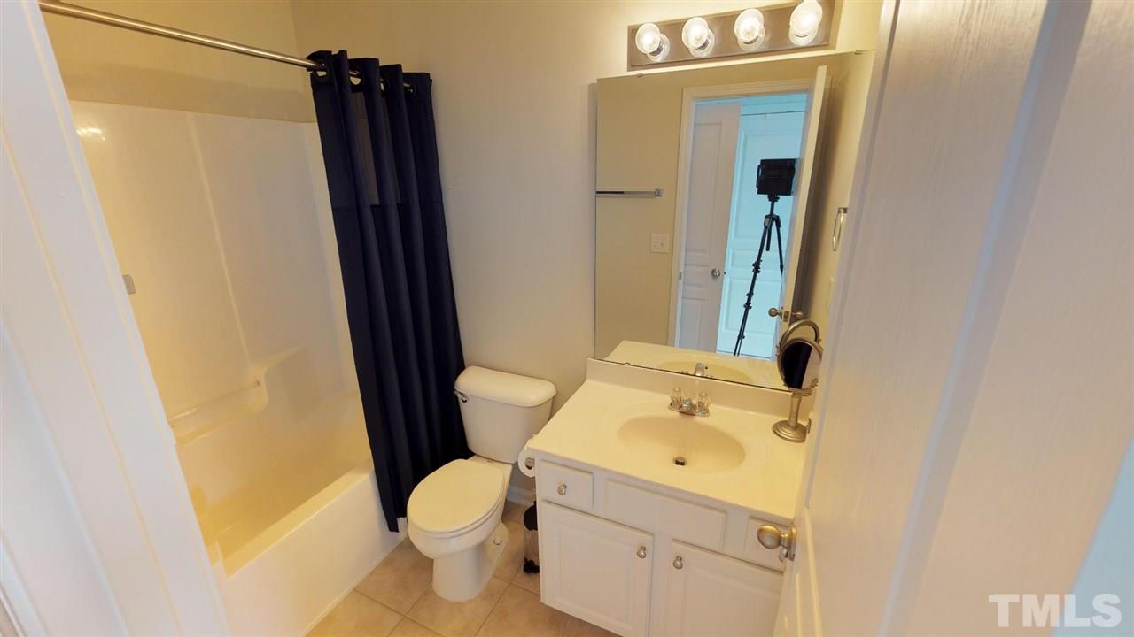 5233 Moonview Court Raleigh, NC 27606 - Photo 12 of 25 This Bathroom off the second Owner Suite has tile flooring