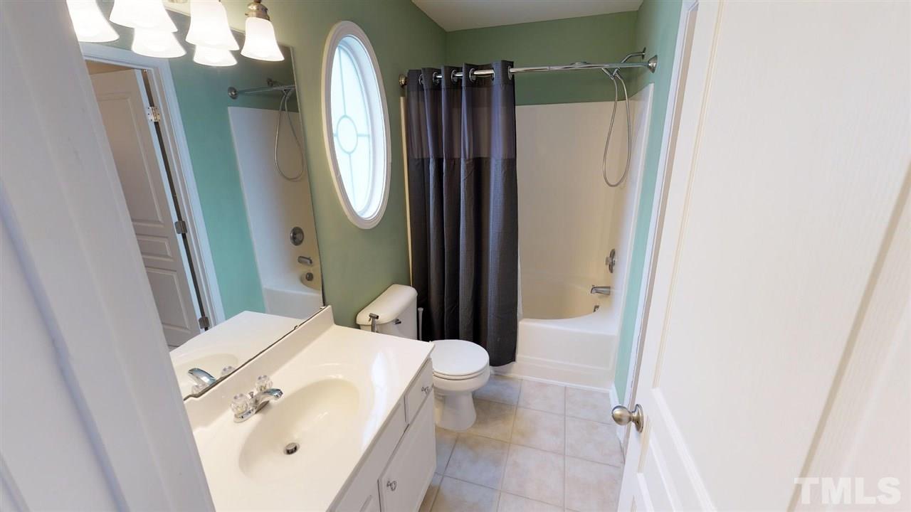5233 Moonview Court Raleigh, NC 27606 - Photo 20 of 25 Garden Tub and Shower Combo, Tile Flooring, Privacy Oval Window
