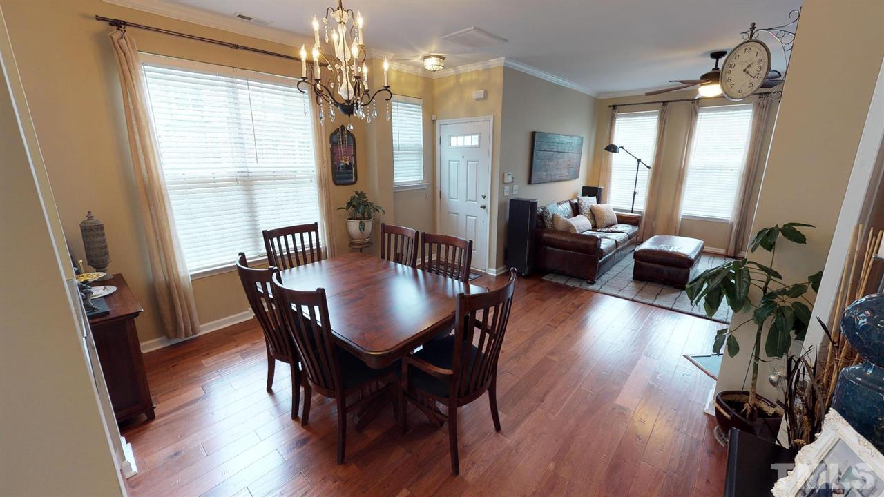 5233 Moonview Court Raleigh, NC 27606 - Photo 6 of 25 Wide Plank Hardwood Flooring continues, 2" Faux Wood Blinds Throughout