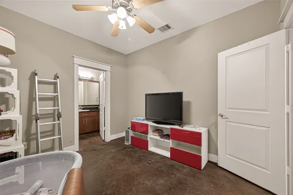a view of a livingroom with furniture and a flat screen tv