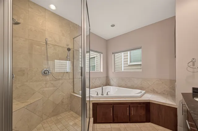a bathroom with a sink a shower and a mirror