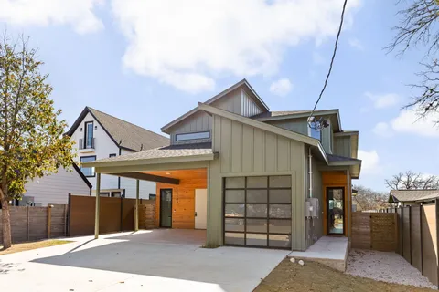 a front view of a house with a garage