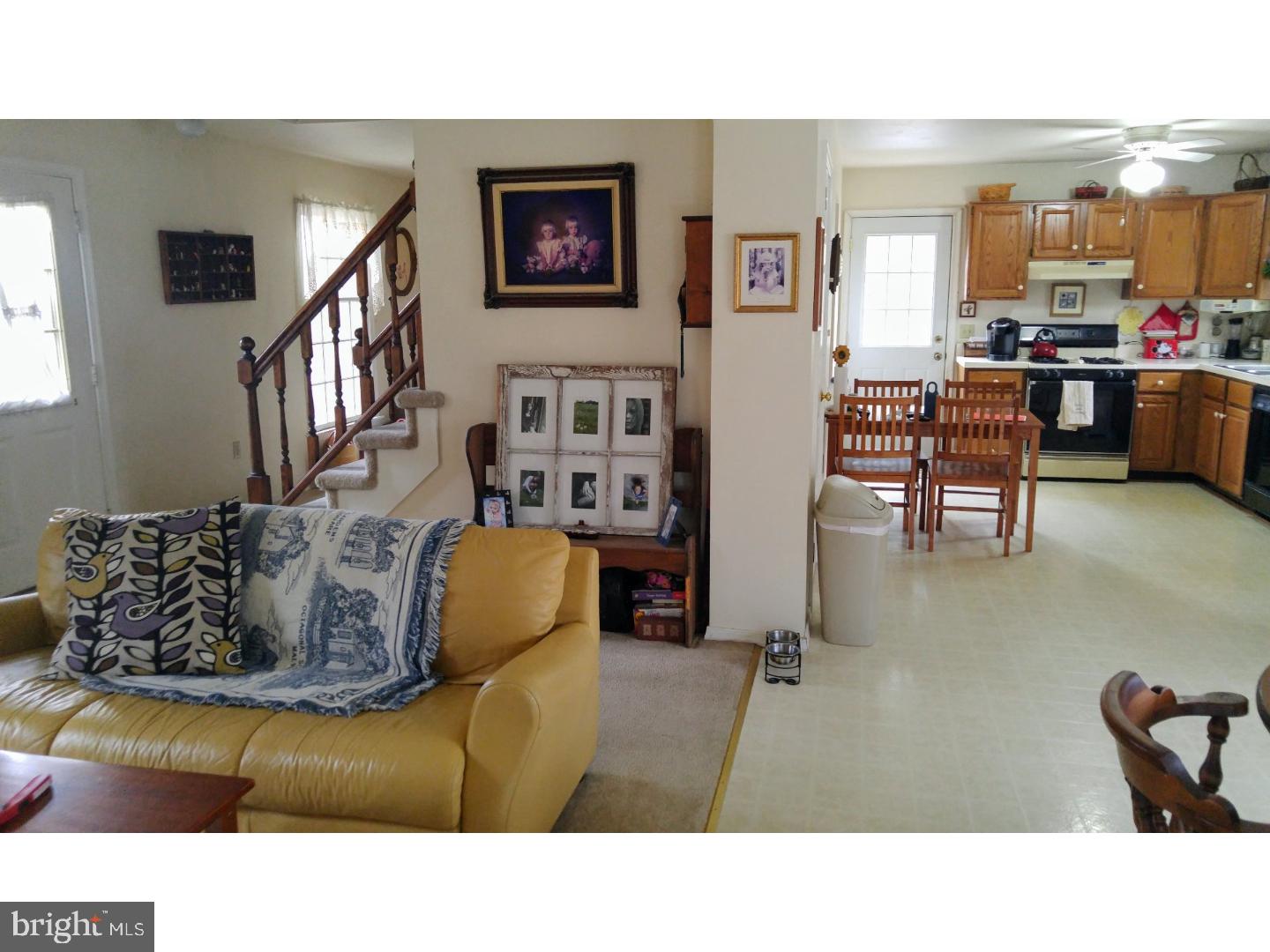 112 Peacedale Road Landenberg, PA 19350 - Photo 3 of 4 a living room with furniture and a dining table
