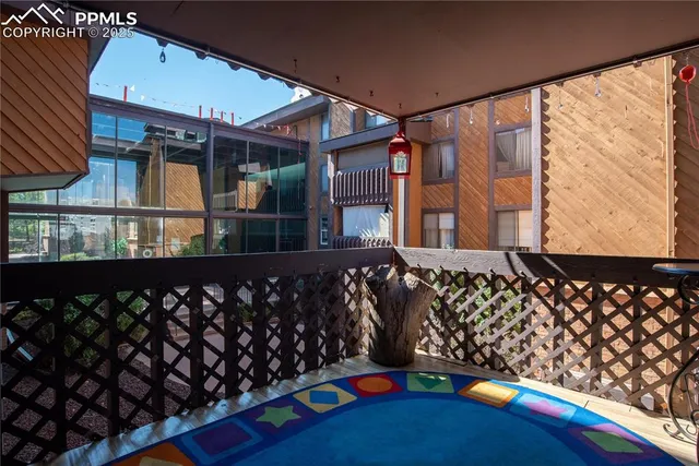 a black and white bench sitting in front of a building