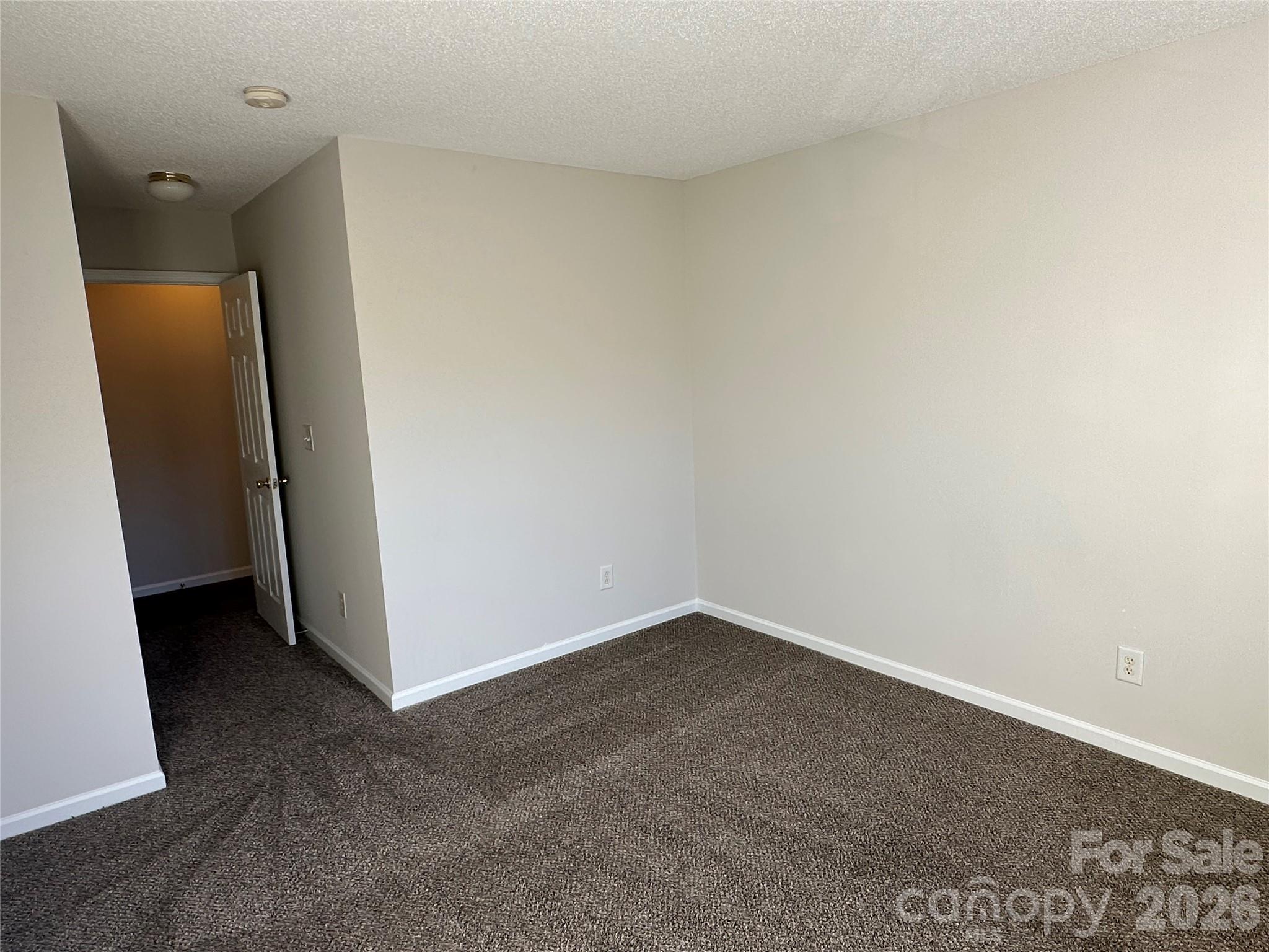 5227 Magnolia Tree Lane Charlotte, NC 28215 - Photo 15 of 20 an empty room with a door