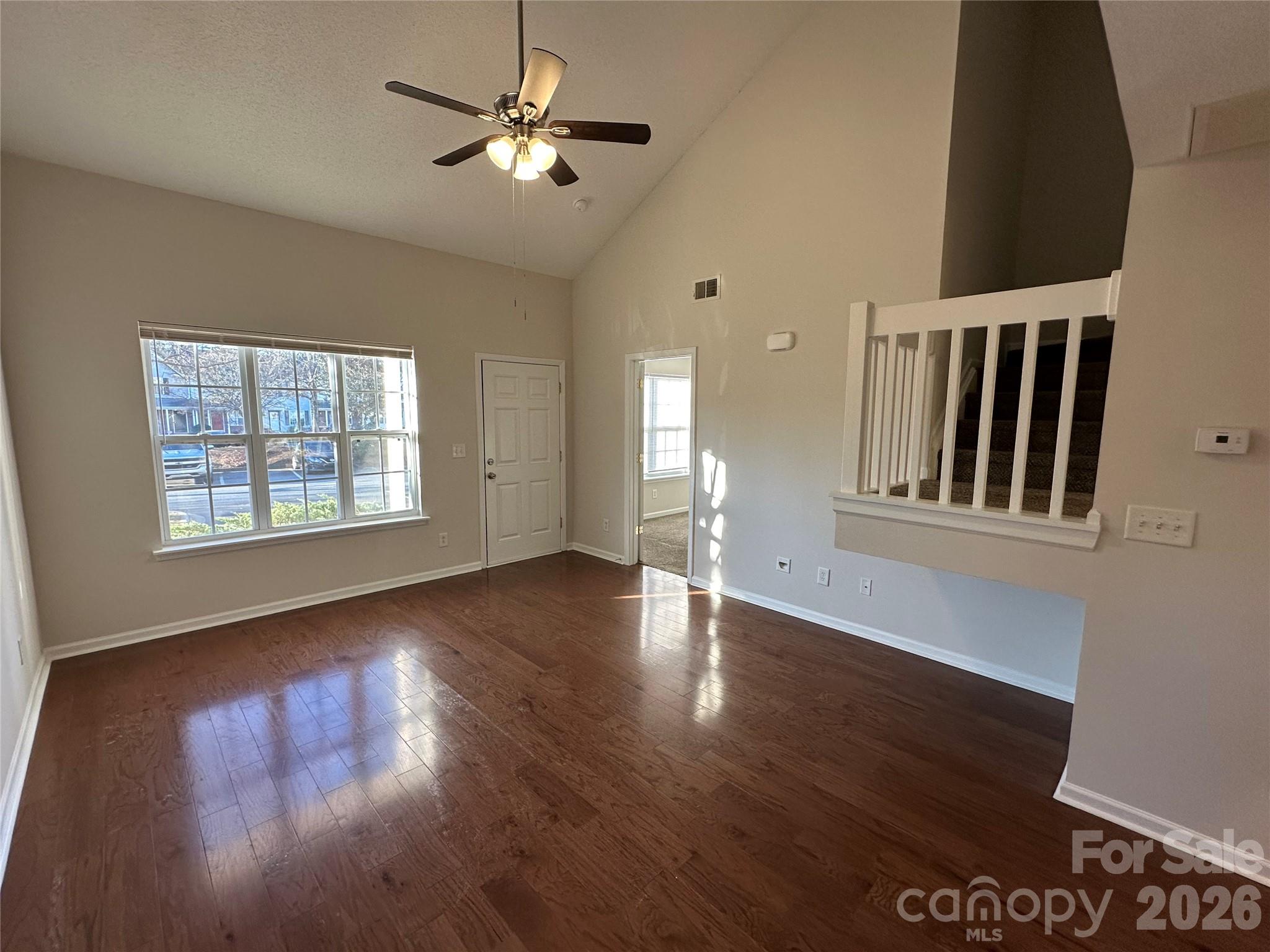 5227 Magnolia Tree Lane Charlotte, NC 28215 - Photo 6 of 20 a view of an empty room with wooden floor and a window
