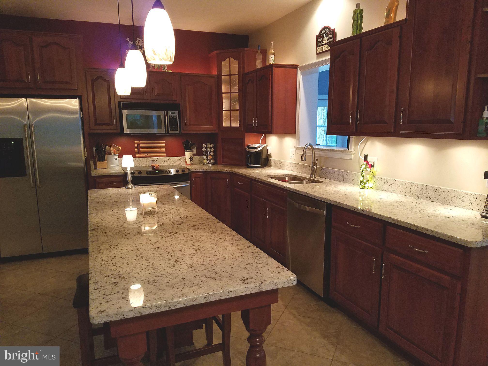 3019 Lexus Drive Spring Grove, PA 17362 - Photo 8 of 39 Cherry cabinets with granite counters and island