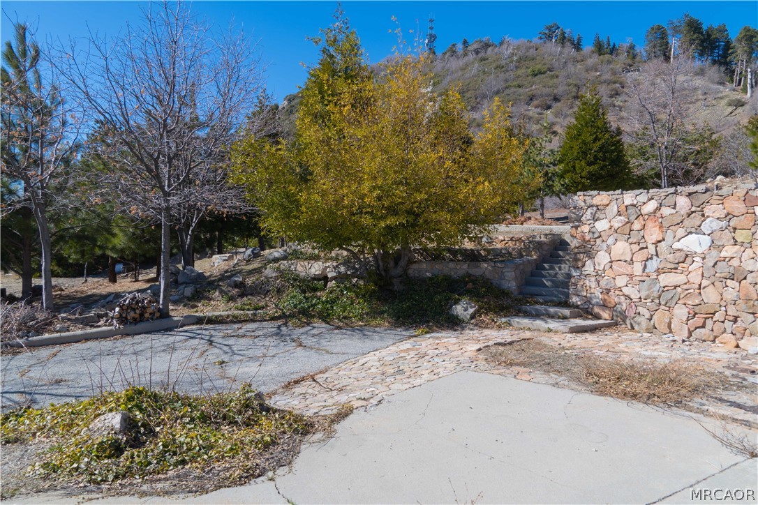 26262 Highway 18 Rimforest, CA 92378 - Photo 19 of 24 a view of a pathway with a yard