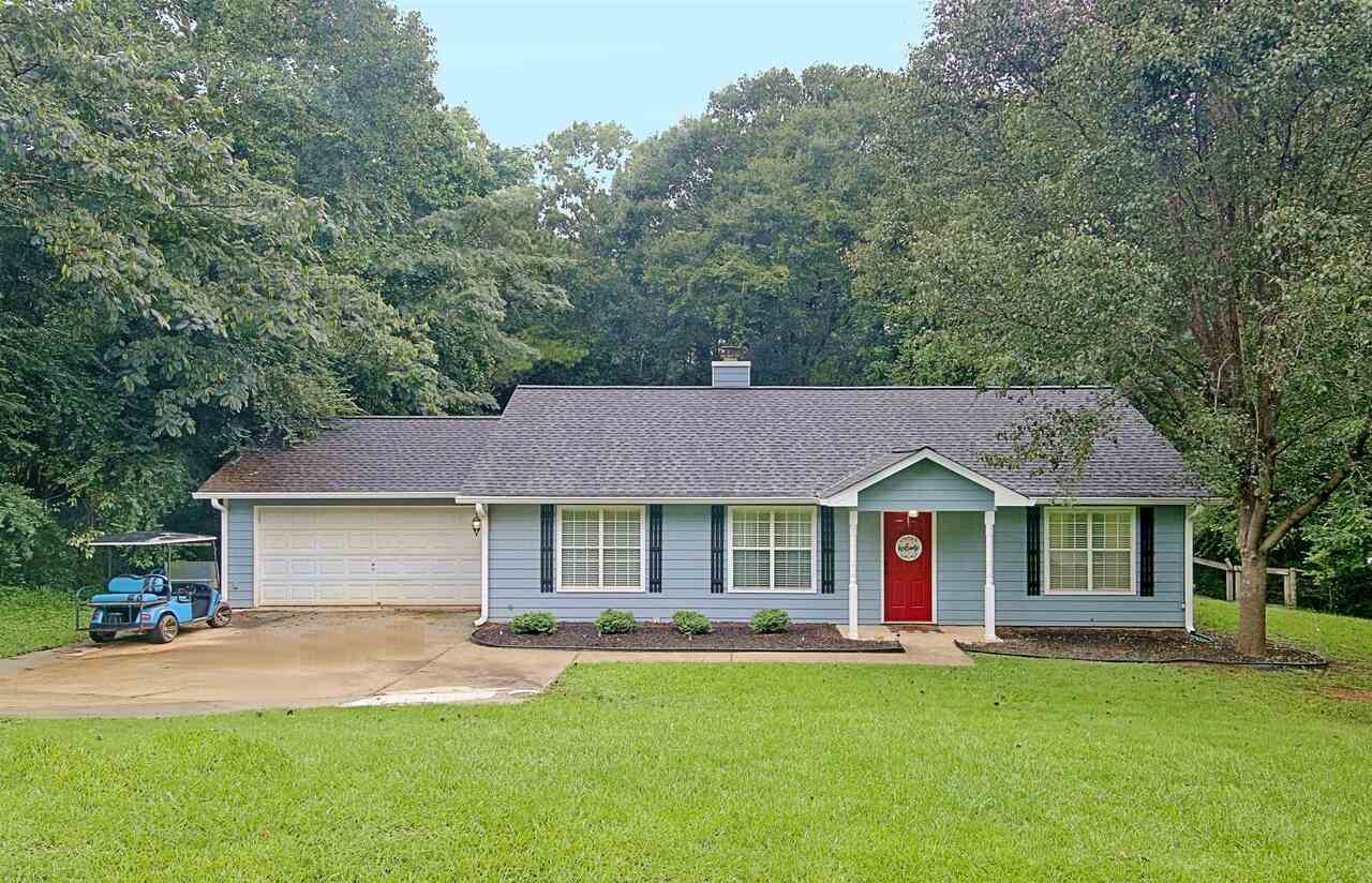 20 Ridge Drive Senoia, GA 30276 - Photo 1 of 1 a front view of a house with a garden and yard