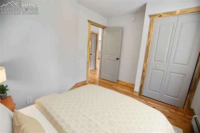 a bedroom with a bed and a mirror