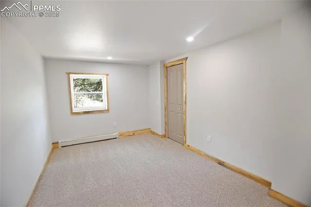 a view of an empty room with a sink
