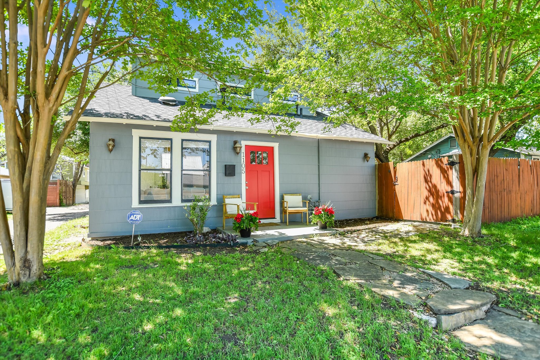 front view of a house with a yard