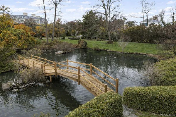 a view of a lake with a house in the background