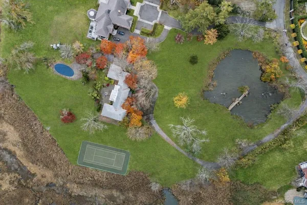 an aerial view of a house with a yard