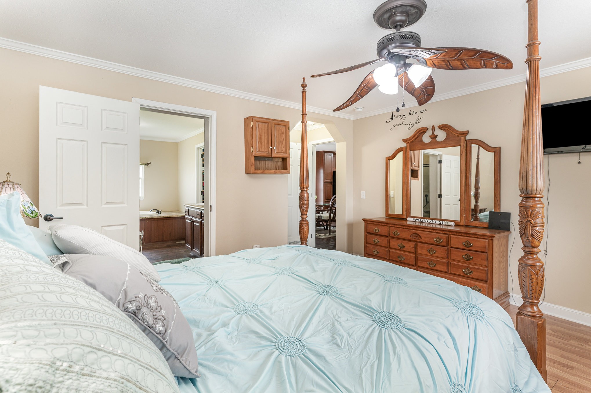 4075 Woodard Road Springfield, TN 37172 - Photo 14 of 30 a bed room with a bed mirror and a chandelier