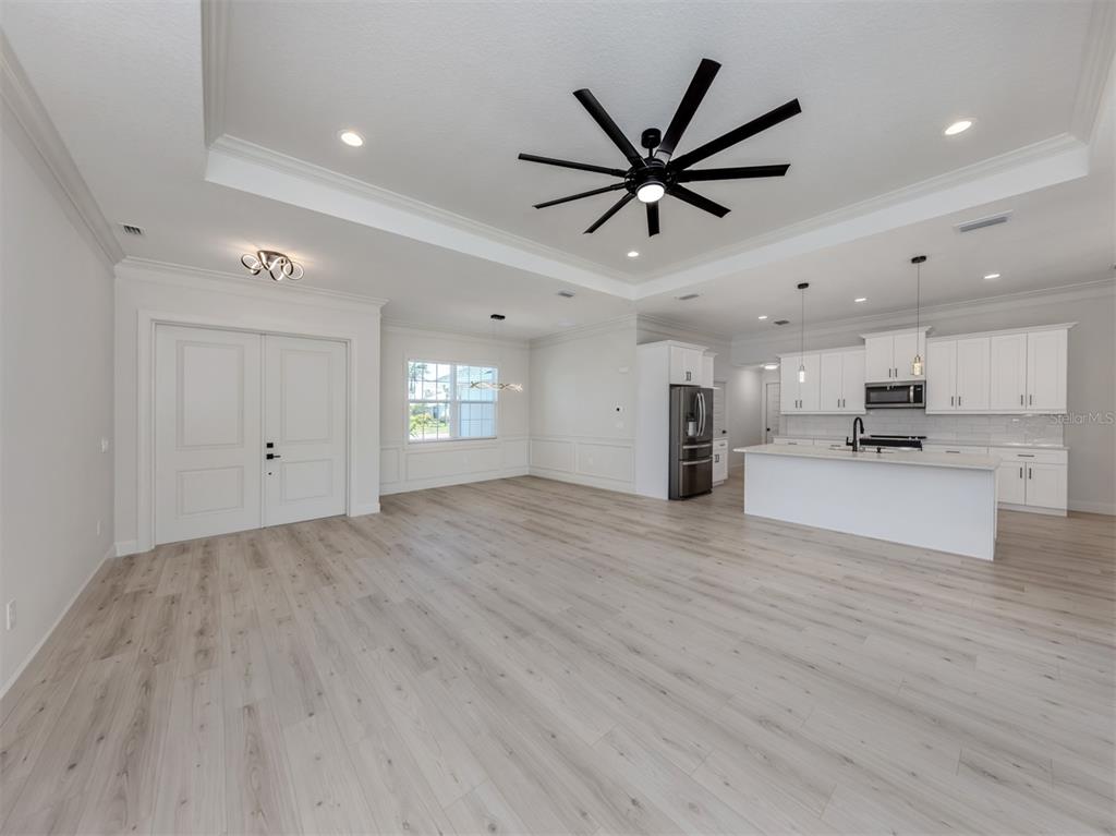 65 Fairway Road Rotonda West, FL 33947 - Photo 11 of 40 a view of empty room with wooden floor and window