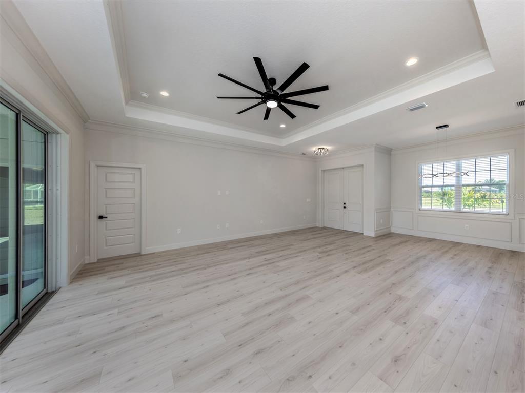 65 Fairway Road Rotonda West, FL 33947 - Photo 13 of 40 an empty room with window and a ceiling fan