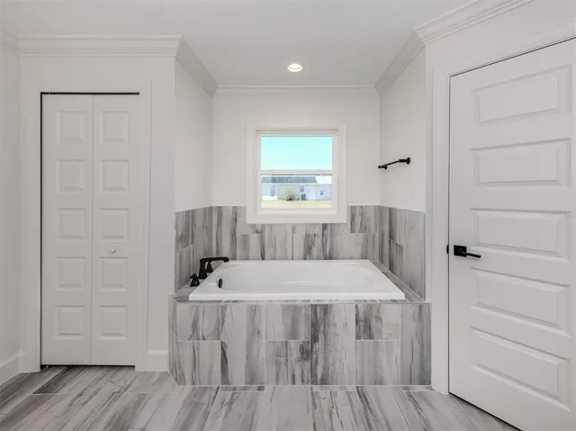 a bathroom with a shower and a sink