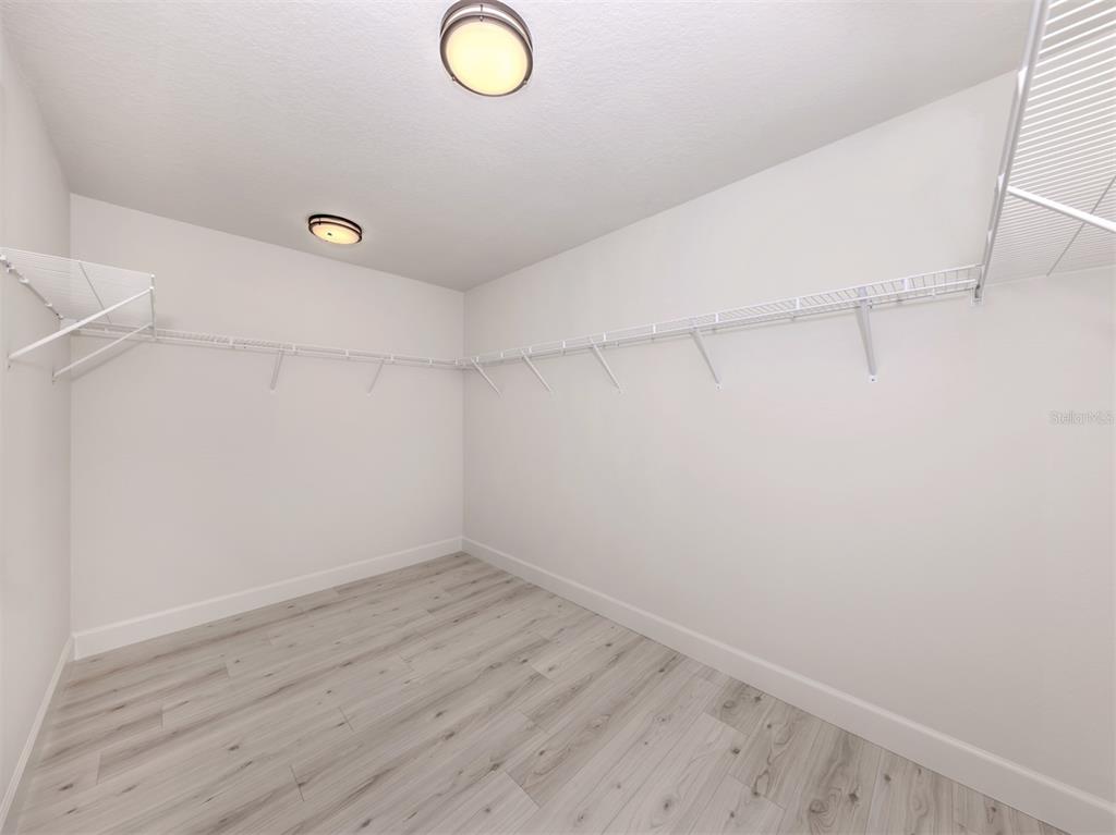 65 Fairway Road Rotonda West, FL 33947 - Photo 26 of 40 a view of a utility room with wooden floor