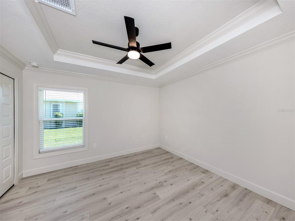 65 Fairway Road Rotonda West, FL 33947 - Photo 27 of 40 wooden floor in an empty room with a window