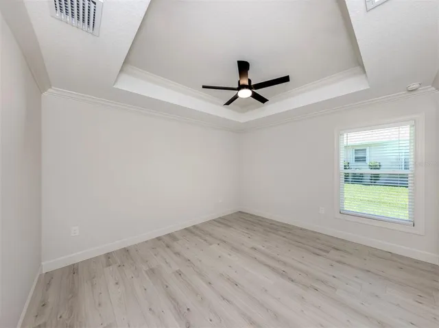 a bathroom with a sink a toilet and a large mirror