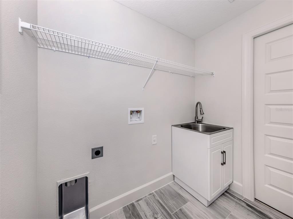 65 Fairway Road Rotonda West, FL 33947 - Photo 30 of 40 a view of a storage and utility room with closet